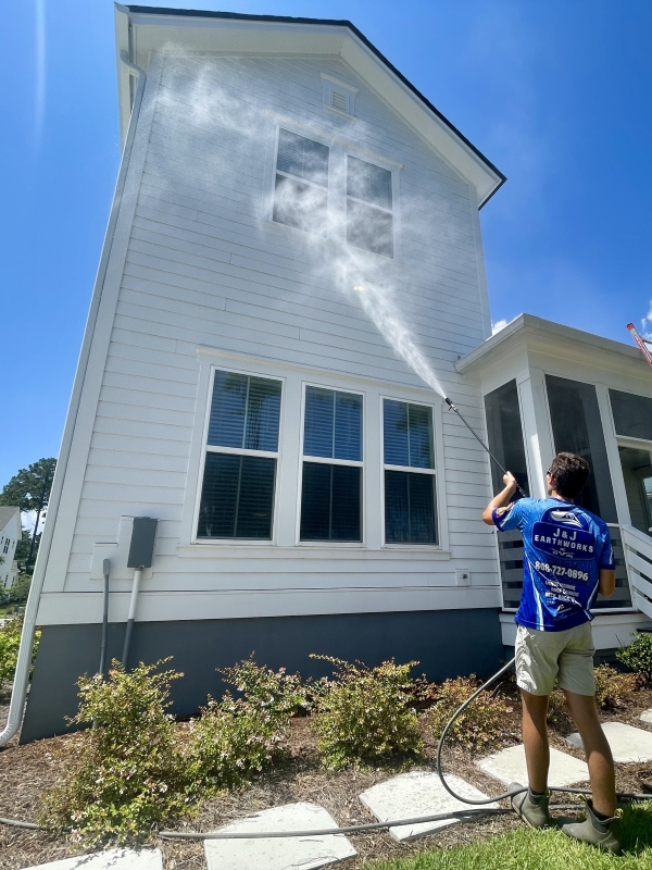 J&J Earthworks LLC performing house washing for Mount Pleasant area home.